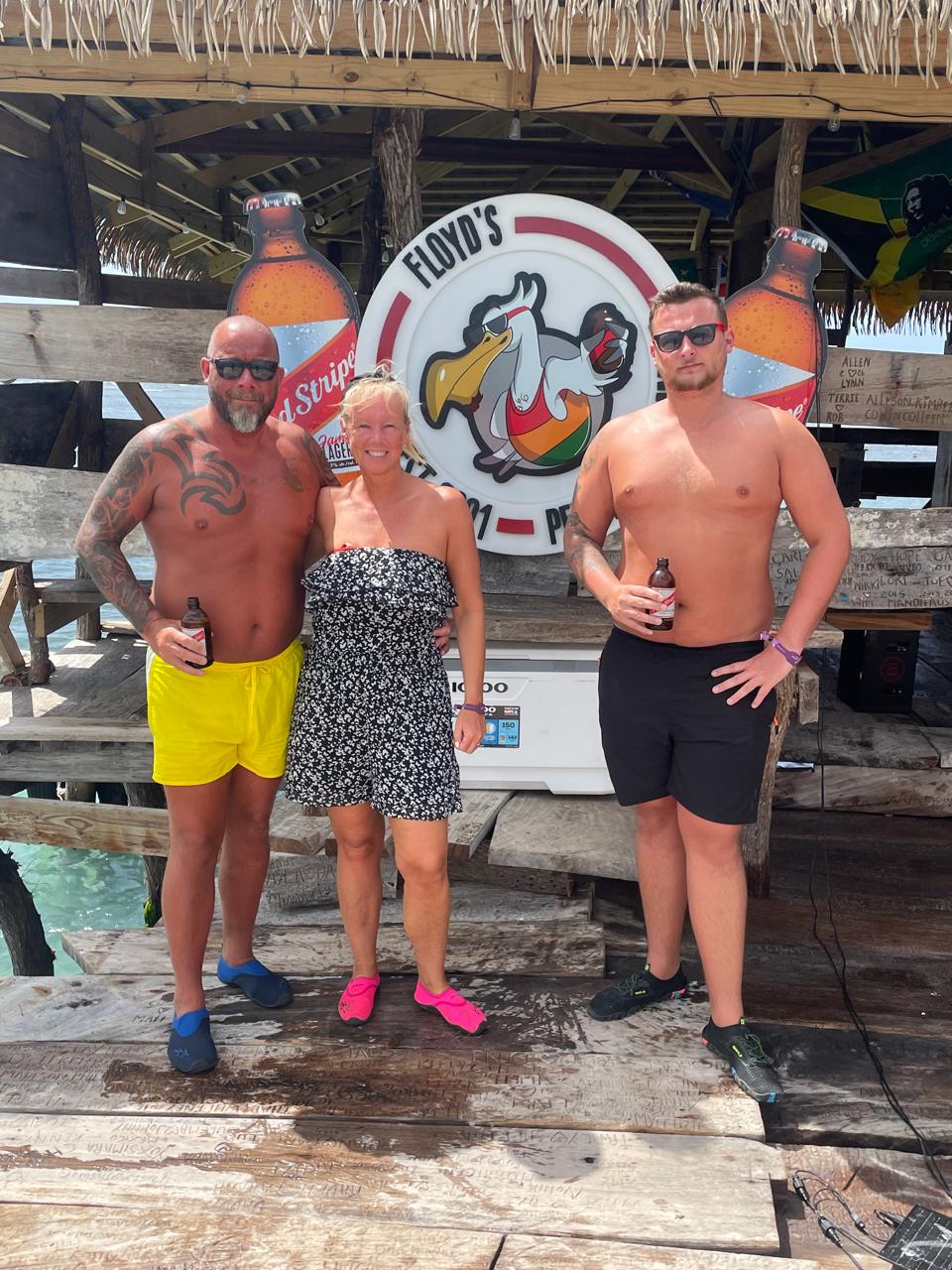 Group of guests with drinks at the bar