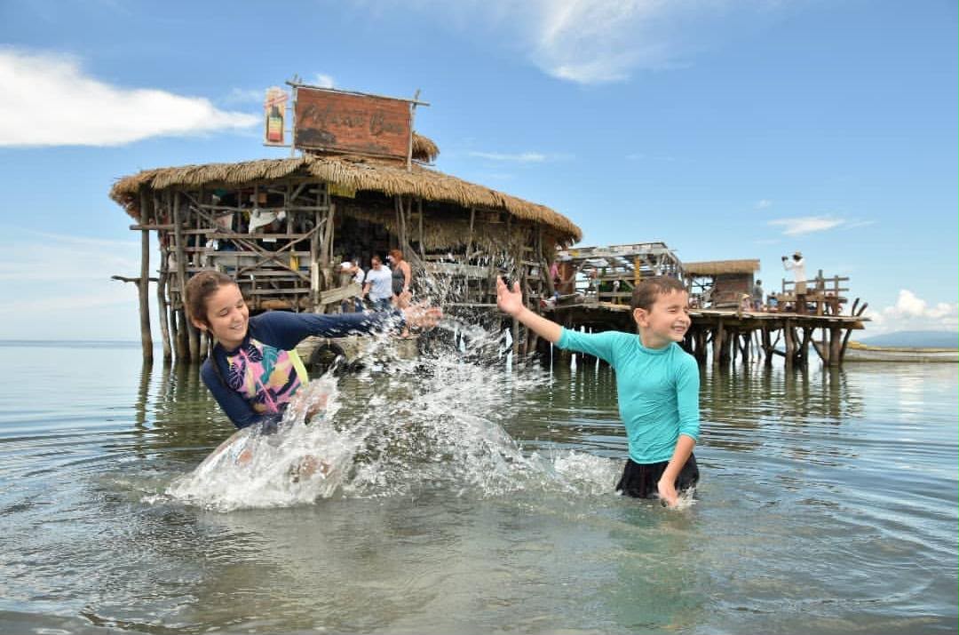 Guests splashing in the water at Pelican Bar